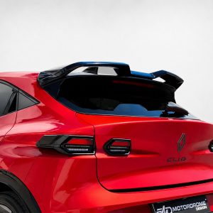 Rear view of a bright red sports SUV with a large black rear spoiler and dark rear window tint