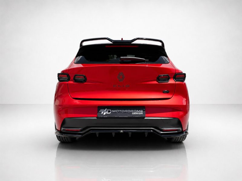 Rear view of a red Renault Clio hatchback with a black spoiler and glossy finish against a light backdrop.