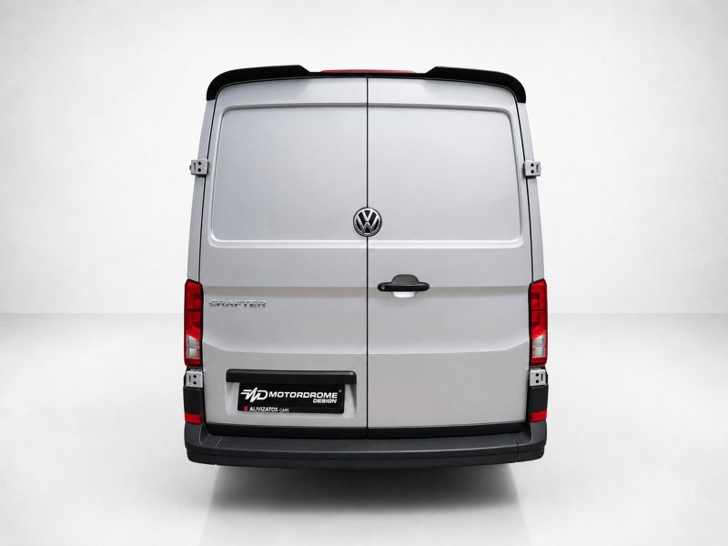 A-575_3jpg - OPSHOLDERS Rear view of a silver Volkswagen Crafter van with twin back doors, VW emblem, and red tail lights in a studio setting.