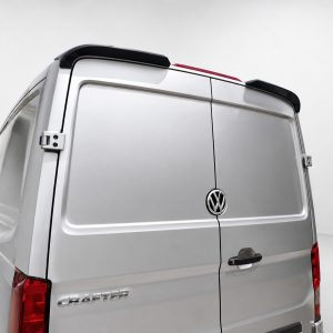Rear view of a silver Volkswagen Crafter cargo van with double back doors and VW emblem in the center of the doors.