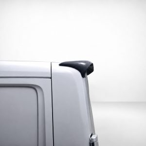 A-576_5jpg - OPSHOLDERS Light gray van's rear corner with a black roof spoiler or spoiler-like accessory on the top edge. It highlights the tail end of the vehicle.