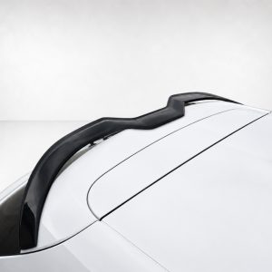 Close-up of a white car roof featuring a black roof rail running along the center of the roof.