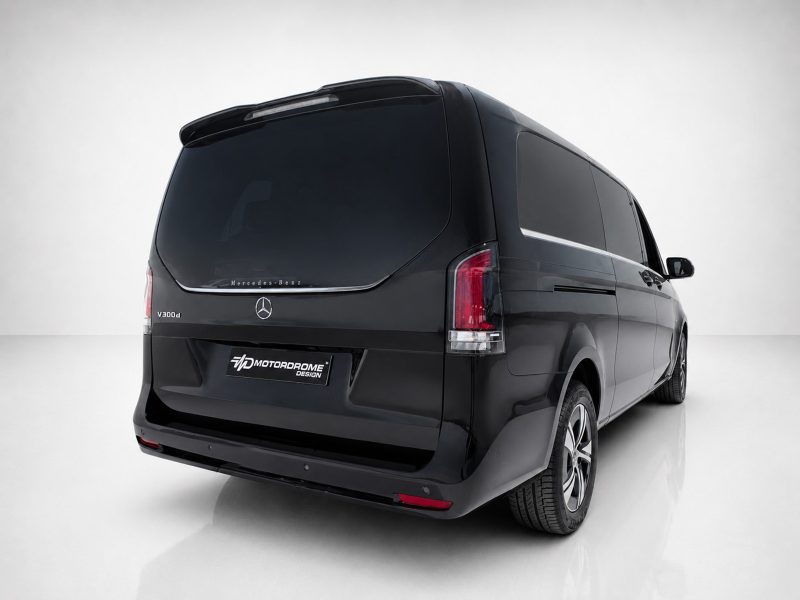 A-578_4jpg - OPSHOLDERS Rear-left three-quarter view of a black Mercedes-Benz V300d van in a studio, with tinted windows and Motordome Design plate on the bumper.