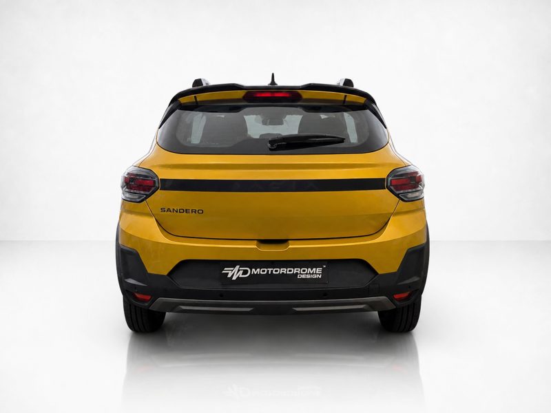 A-579_3jpg - OPSHOLDERS Rear view of a yellow Sandero SUV with a black horizontal stripe and visible tail lights, parked indoors.