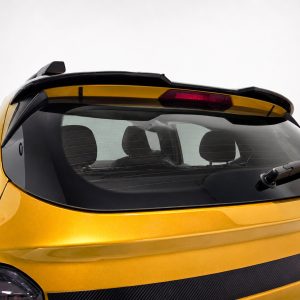 A-579_5jpg - OPSHOLDERS Rear view of a yellow car showing the back windshield, defroster lines, and rear wiper.