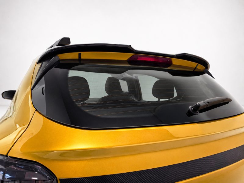 A-579_5jpg - OPSHOLDERS Rear view of a yellow car showing the back windshield, defroster lines, and rear wiper.