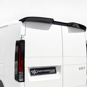 Rear of a white van with a black roof spoiler and visible taillights; plate area shows 'MOTORDROME DESIGN' logo.