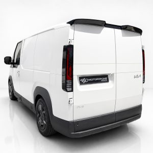 White cargo van shown from the rear-left, with tall vertical taillights and a Motordrome Design badge on the rear door.