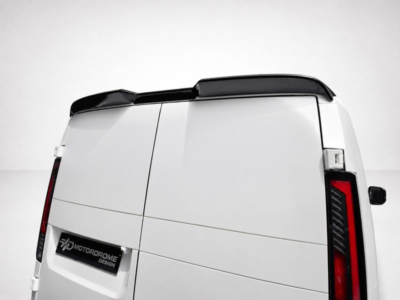 Rear of a white cargo van with a black roof spoiler and partial taillights visible on the right side.