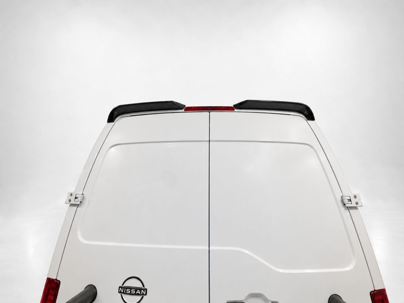 White Nissan van rear view with split doors and red brake light bar on top edge against a light gray background