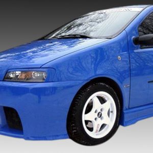 Blue hatchback car shown from the front-left, featuring an aftermarket body kit and white alloy wheels against a gray gradient background.