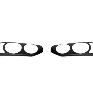 Pair of black car headlight bezels laid flat on a white background, showing left and right sides with circular cutouts in each bezel