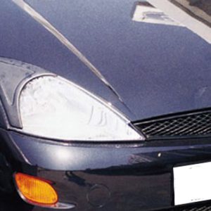 Close-up of the front-left corner of a dark blue Ford car, showing the headlight, orange turn signal, and grille area.