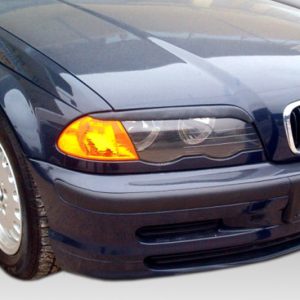 Front-left view of a dark blue BMW with its orange left turn signal lit