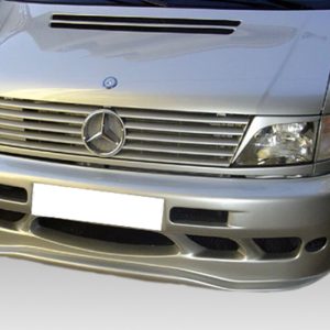 Front view of a silver Mercedes van with a custom body kit and prominent grille emblem visible