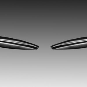 Two glossy, seed-shaped objects floating apart against a gray gradient background.
