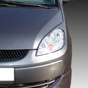 Front left view of a silver Mitsubishi car, showing the headlight, grille, and hood against a gray gradient background.