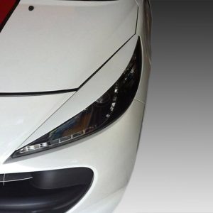 Close-up of the front left section of a white sports car with a red racing stripe and headlight edge visible