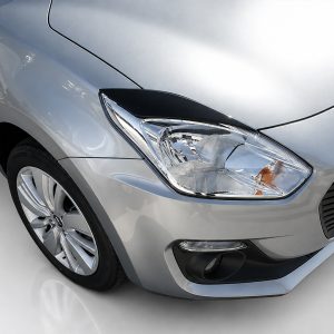 Close-up of a silver car's front left headlight, hood, and wheel viewed from an angled perspective.