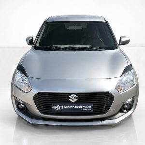 FR000155_2jpg - OPSHOLDERS Front view of a silver Suzuki car, showing grille, headlights, and emblem in a neutral studio setting.