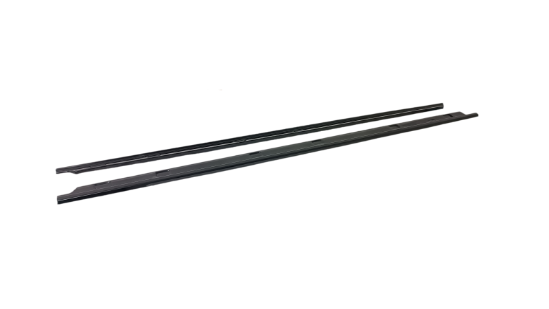IMG_20231128_082604png - OPSHOLDERS Pair of black windshield wiper blades laid diagonally on a white background, lengthier rubber blades for a car’s windshield