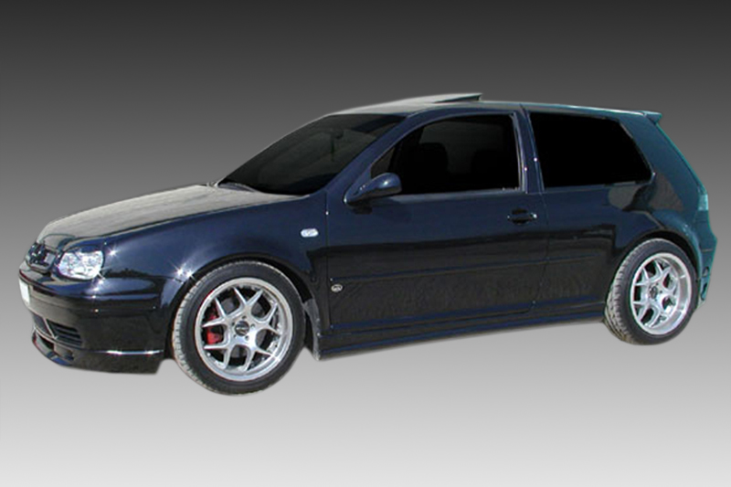 K12-003_1jpg - OPSHOLDERS Dark blue hatchback with silver aftermarket wheels, shown in profile against a gray gradient background.