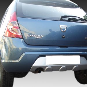 Rear view of a blue Dacia Sandero hatchback with badges visible on a gradient background.