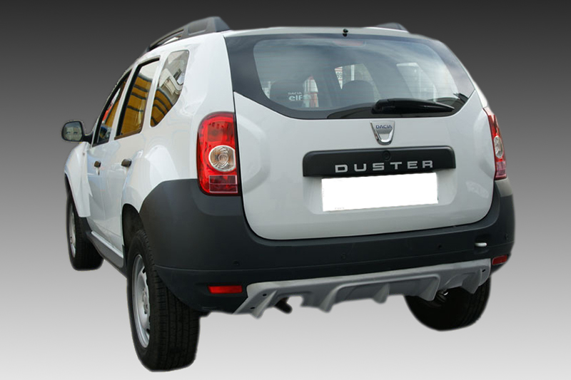 K139-002_1jpg - OPSHOLDERS Rear view of a white Dacia Duster SUV showing its tailgate and bumper, with the DUSTER badge visible