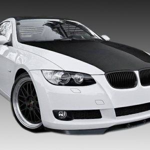 White BMW coupe with a black hood, shown from a front-quarter angle with dark alloy wheels and sporty styling.