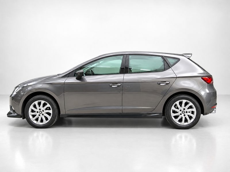 Side profile of a gray compact hatchback car in a studio setting with white background.