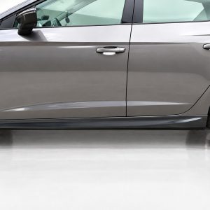 Side view of a gray sedan showing the front and rear doors, lower body line, and wheel on the right side.