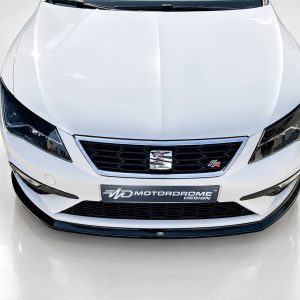 Top-down view of a white car front, showing the grille, headlights, and hood edges.
