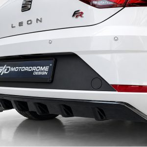 Rear of a white Leon FR hatchback, showing LEON and FR badges with a Motordrome Design license plate area.