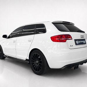 K151-004_5jpg - OPSHOLDERS Rear three-quarter view of a white Audi A3 Avant with black multi-spoke wheels in a studio setup, plate reads 'MOTORROME DESIGN'