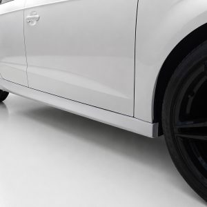 K152-003_2jpg - OPSHOLDERS Side view of a white car showing the doors, lower body panel, and a black alloy wheel with a glossy rim.