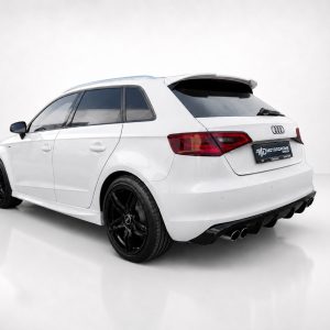 K152-003_3jpg - OPSHOLDERS Rear three-quarter view of a white Audi hatchback with black aftermarket wheels in a studio setting