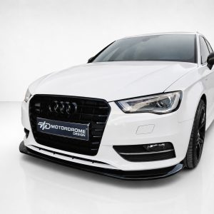 White Audi sedan facing front-right, with black grille and 'Motordrome Design' plate visible on the bumper