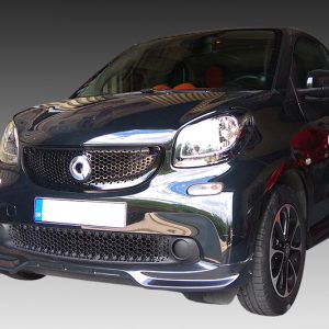 Front three-quarter view of a dark, glossy compact car with a honeycomb grille and red side decals.