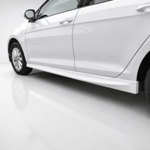K156-003_2jpg - OPSHOLDERS Side view of a white car highlighting the lower door panel and side skirt near the wheels in a bright studio setting.