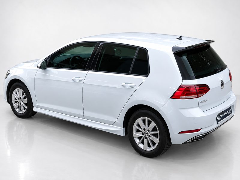 K156-003_3jpg - OPSHOLDERS Rear three-quarter view of a white Volkswagen Golf wagon photographed in a bright studio