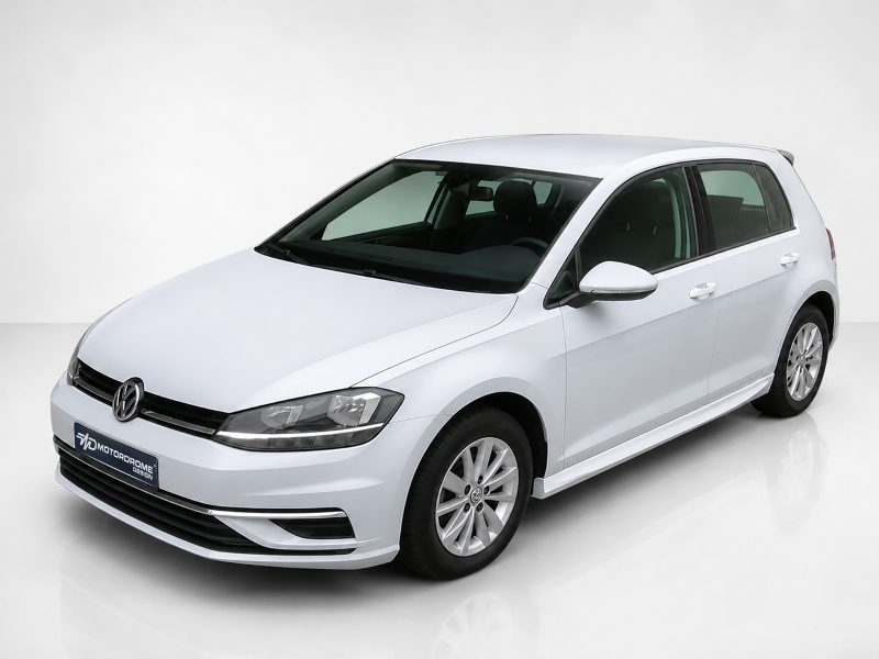 K156-003_4jpg - OPSHOLDERS White Volkswagen sedan shown from a front-left angle in a bright studio setting