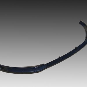 Curved dark-blue automotive bumper piece with three mounting tabs against a gradient background.