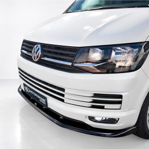 K159-001_3jpg - OPSHOLDERS Front view of a white Volkswagen van showing grille, headlight, and badge