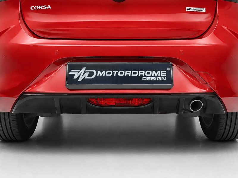 Rear view of a red car with a black Motordrome Design license plate and a visible exhaust on the right side.
