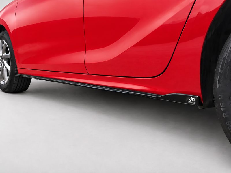 K163-003_4jpg - OPSHOLDERS Close-up of a red car's lower side panel and side skirt with a black logo tag near the wheel.