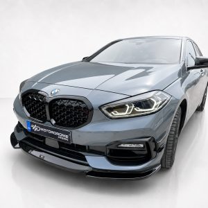 Blue BMW SUV shown from a front three-quarter angle with LED headlights in a clean studio setting.
