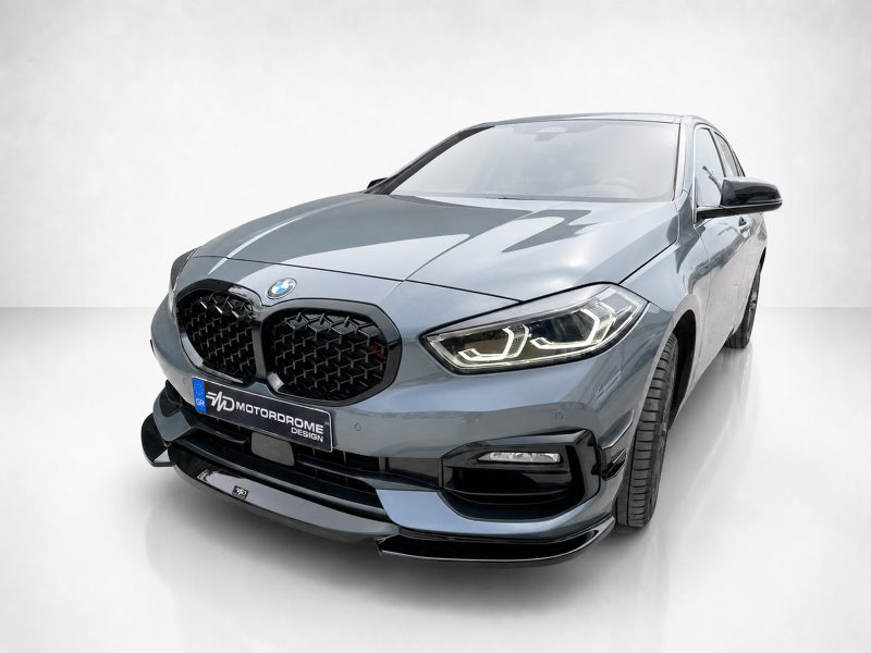 Blue BMW SUV shown from a front three-quarter angle with LED headlights in a clean studio setting.
