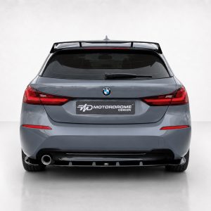 Rear view of a gray BMW SUV with a MotorDrome Design plate and visible BMW emblem on the tailgate