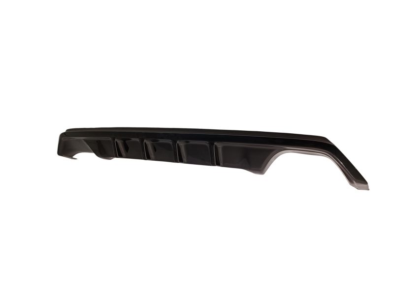 Black automotive rear diffuser/side skirt with vertical fins for a car's underside styling and aerodynamics.