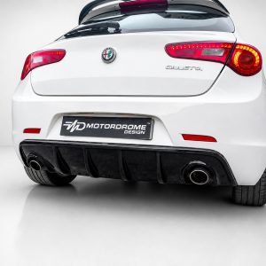 Rear view of a white Alfa Romeo Giulietta with red LED tail lights, badge, and dual exhausts under a black diffuser (Motordrome Design plate).